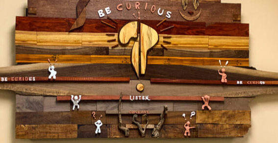 "Be Curious" original wall art in wood and clay